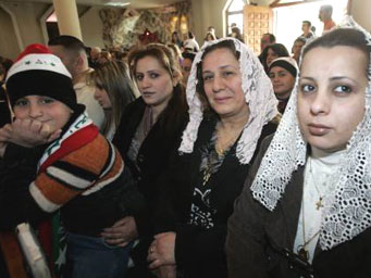 Iraqi women at a church worship.
