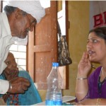 A village elder is all ears to Dr. Alya Batt